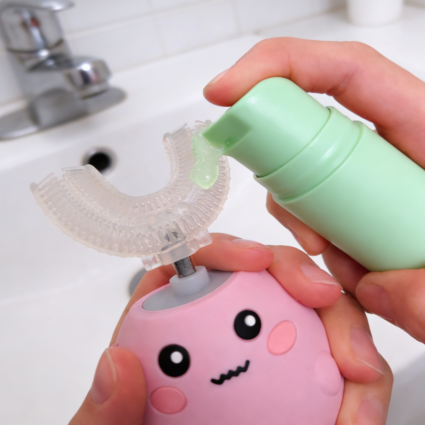 Person using sour apple kids toothpaste
