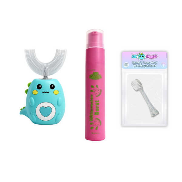 Green dinosaur u shaped toothbrush, pink watermelon burst flavoured toothpaste tube and replacement toothbrush head on a white background