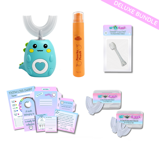 Children's dental care product set with green dinosaur electric u shaped children's toothbrush, peachy peach toothpaste, and other items on a white background. 